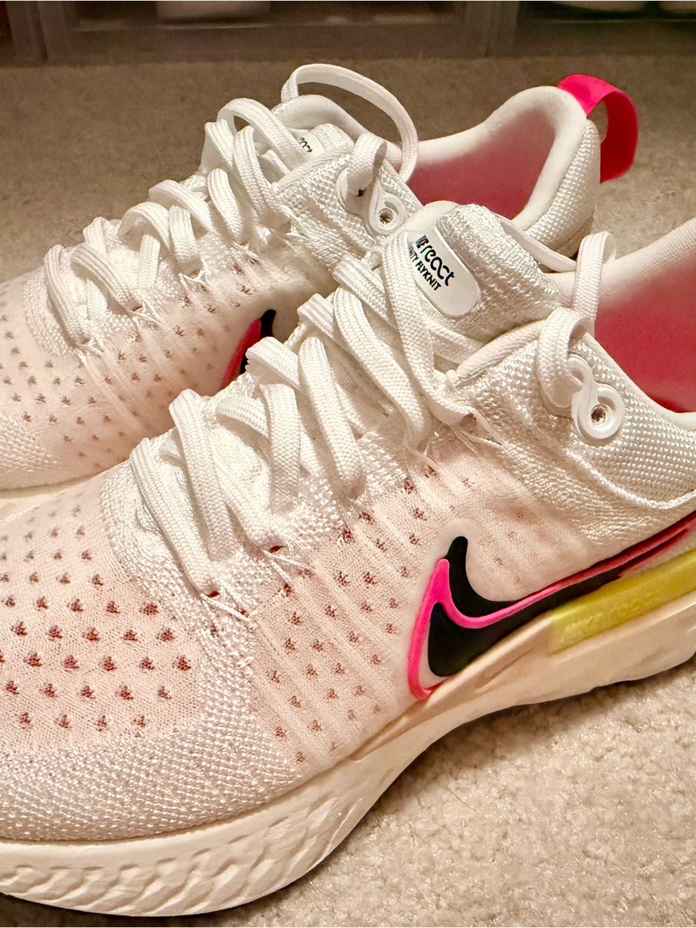 Nike Women's React Shoe White Running Shoes with Pink and Black Accents